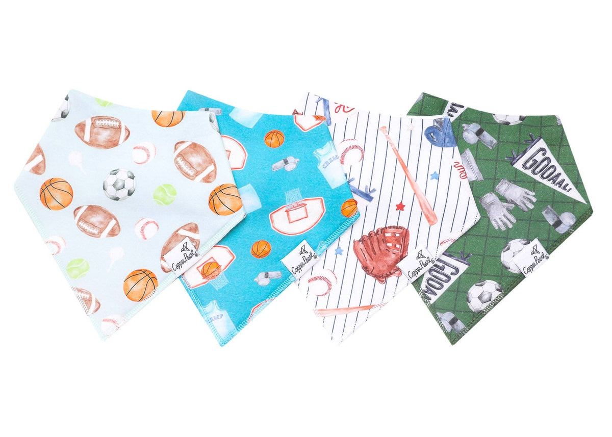 Four triangular pet bandanas with sports-themed prints, including football, basketball, baseball, and golf motifs, arranged overlapping on a white background.