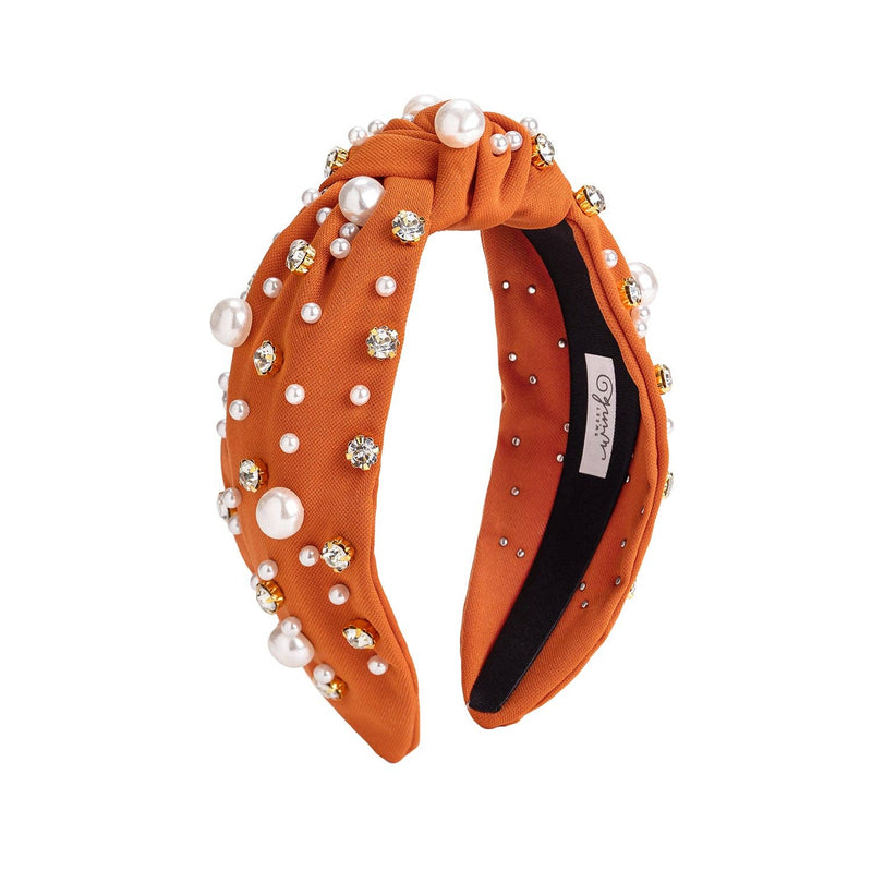 Burnt orange headband with pearls and rhinestones, satin lined.