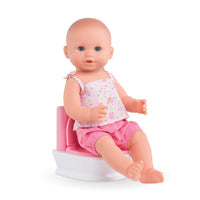 Baby doll sitting on a potty with a white background